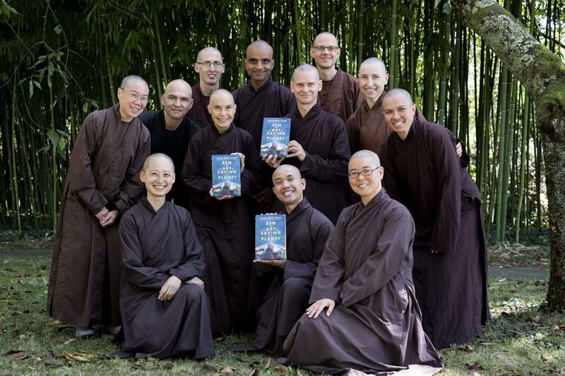 Monastics smiling with book wide landscape 1536x1024